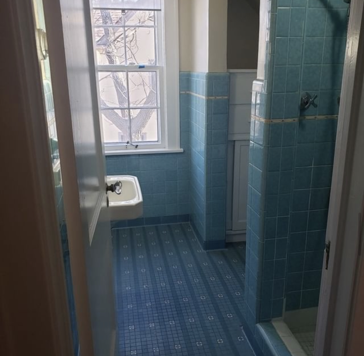 Original 1950s blue-tile attic bathroom before demolition